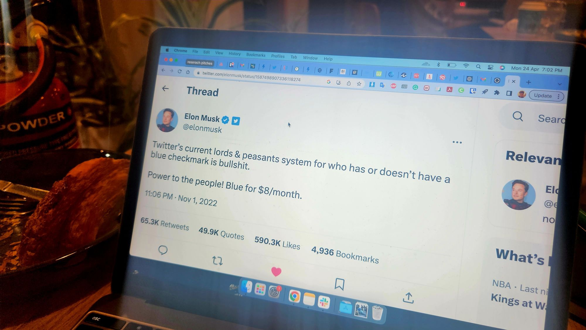Image of an Elon Musk tweet on a laptop