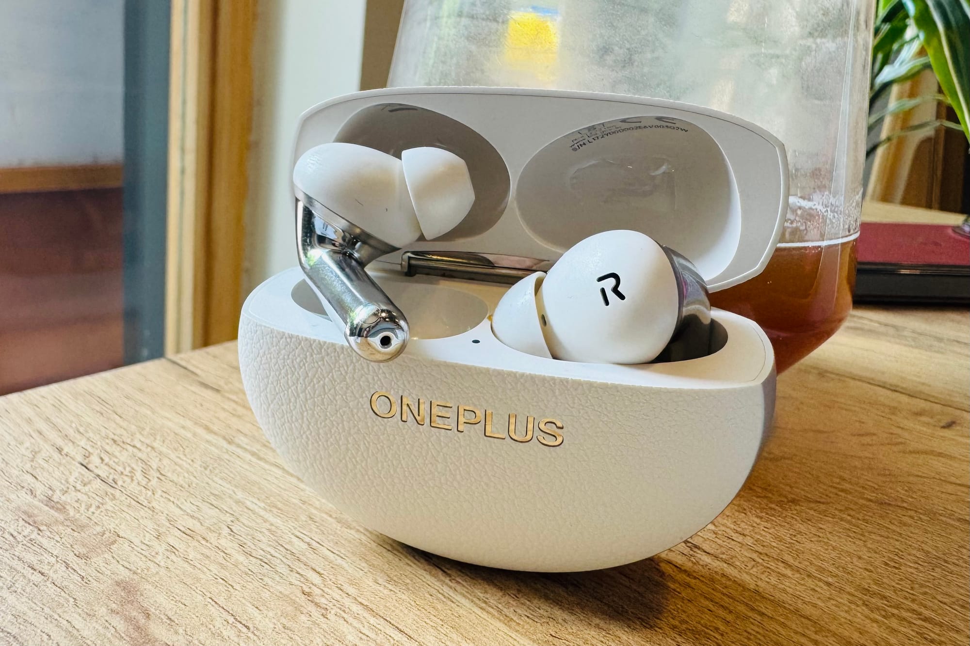 OnePlus Buds Pro 3 earbuds inside their case. 