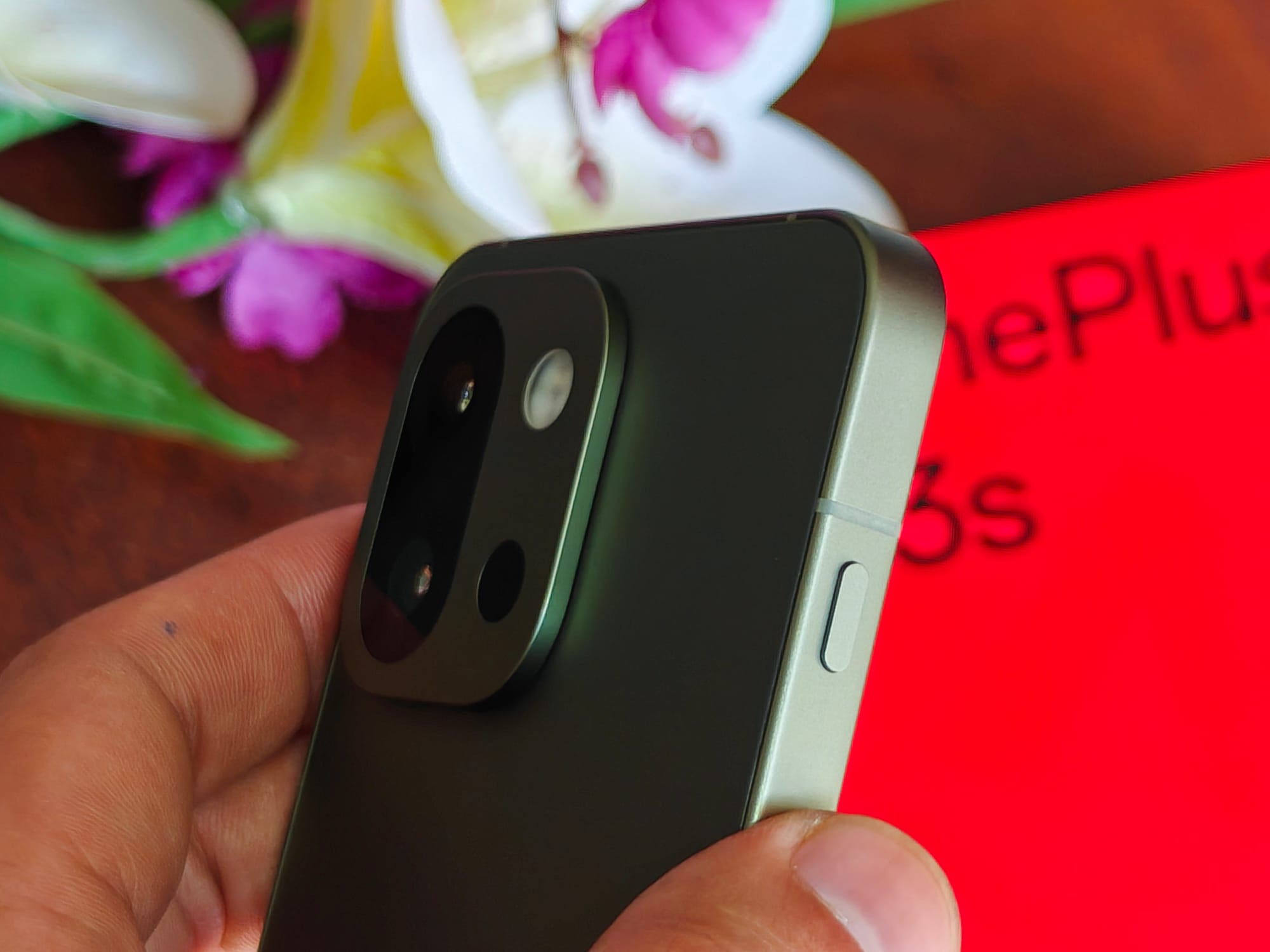 Plus key on OnePlus 13s small compact Android phone in green color, courtesy of Athenil Media.