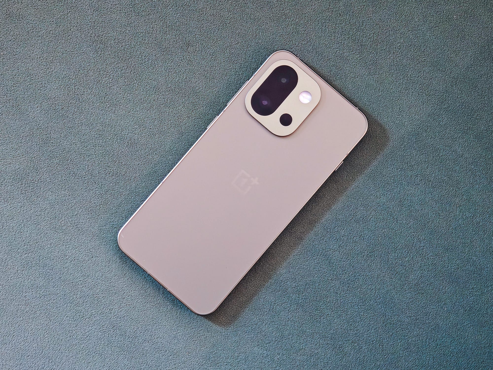 OnePlus 13s small compact Android phone in green color, courtesy of Athenil Media.