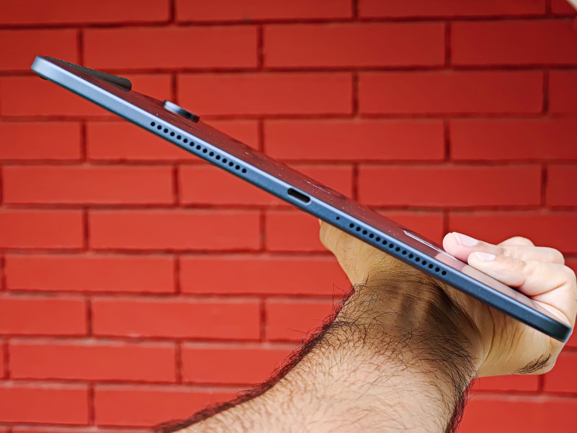 OnePlus Pad 3 held in hand, courtesy of Athenil Media.