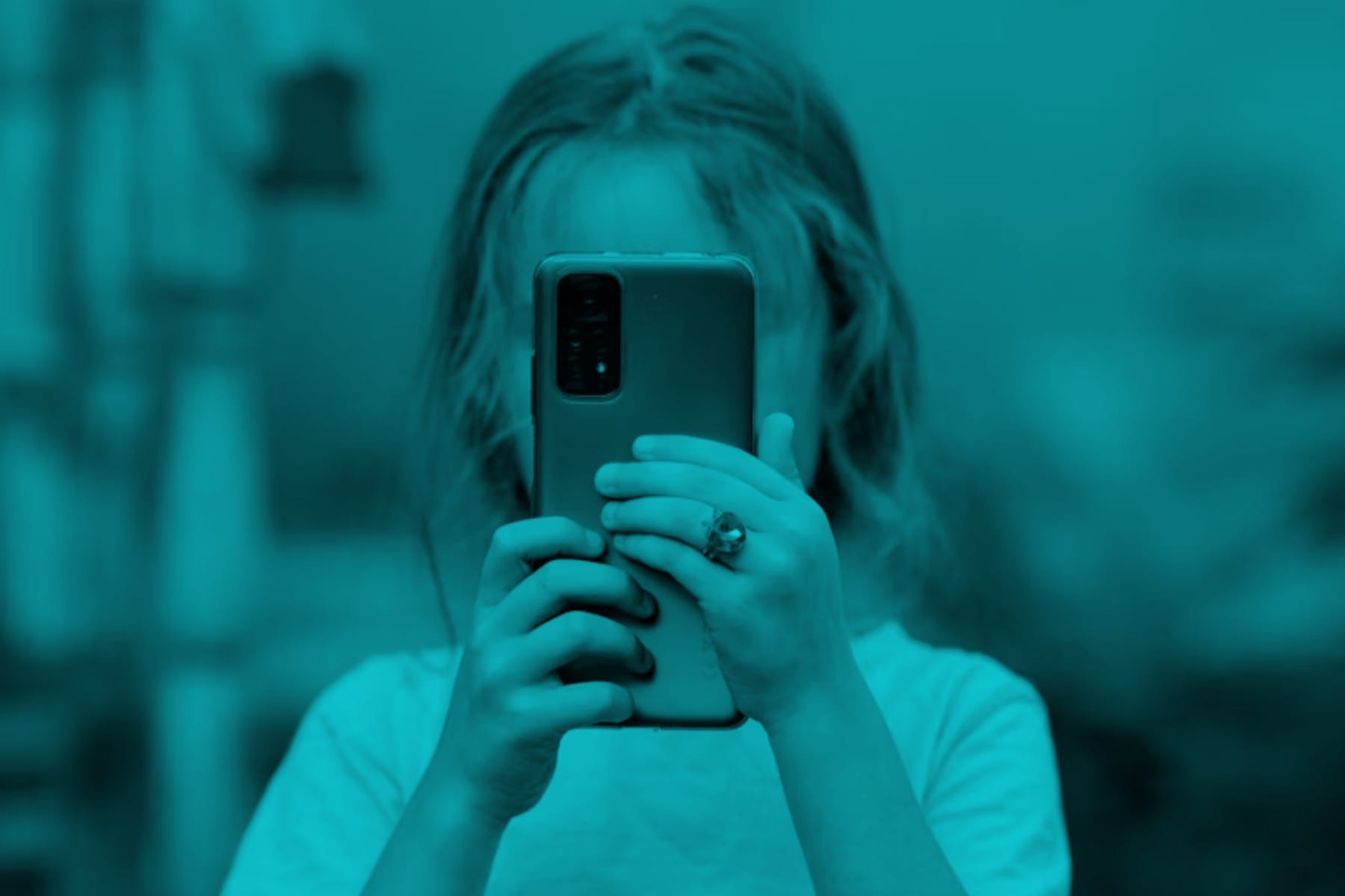 Kid using a phone.