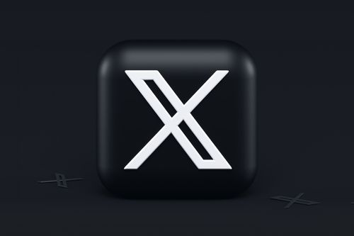 The logo of X on a block