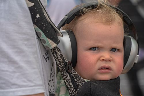 A baby listening to music.