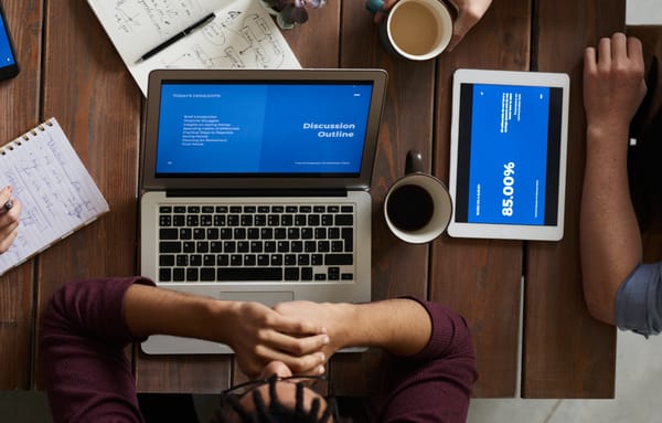 A laptop and tablet on a table 