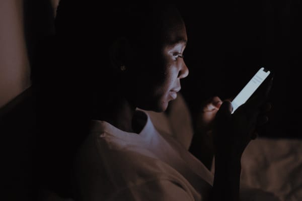 Person using a phone at night